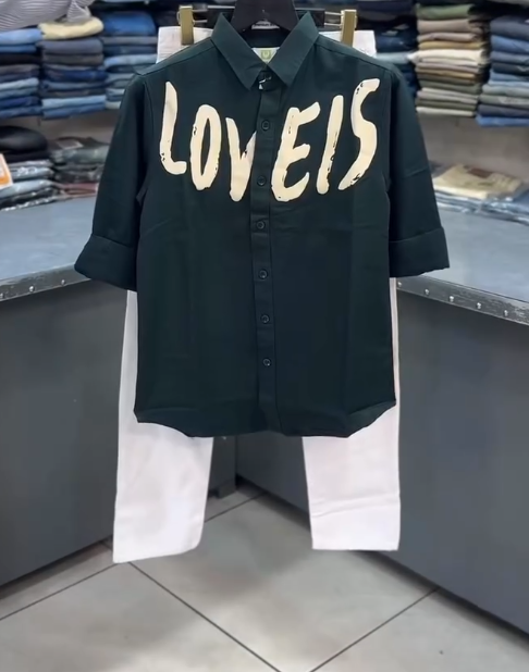 White “LOVEIS.” Graphic Shirt with Dark Jeans – Minimal Style, Maximum Impact