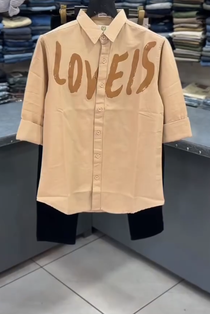 White “LOVEIS.” Graphic Shirt with Dark Jeans – Minimal Style, Maximum Impact