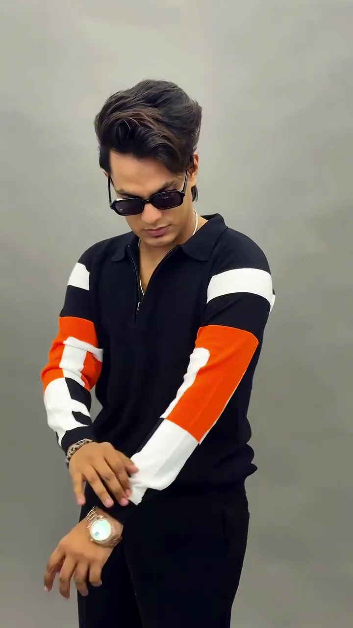 Black Quarter-Zip Polo Shirt with White & Orange Color-Block Sleeves – Sporty Style with Modern Edge