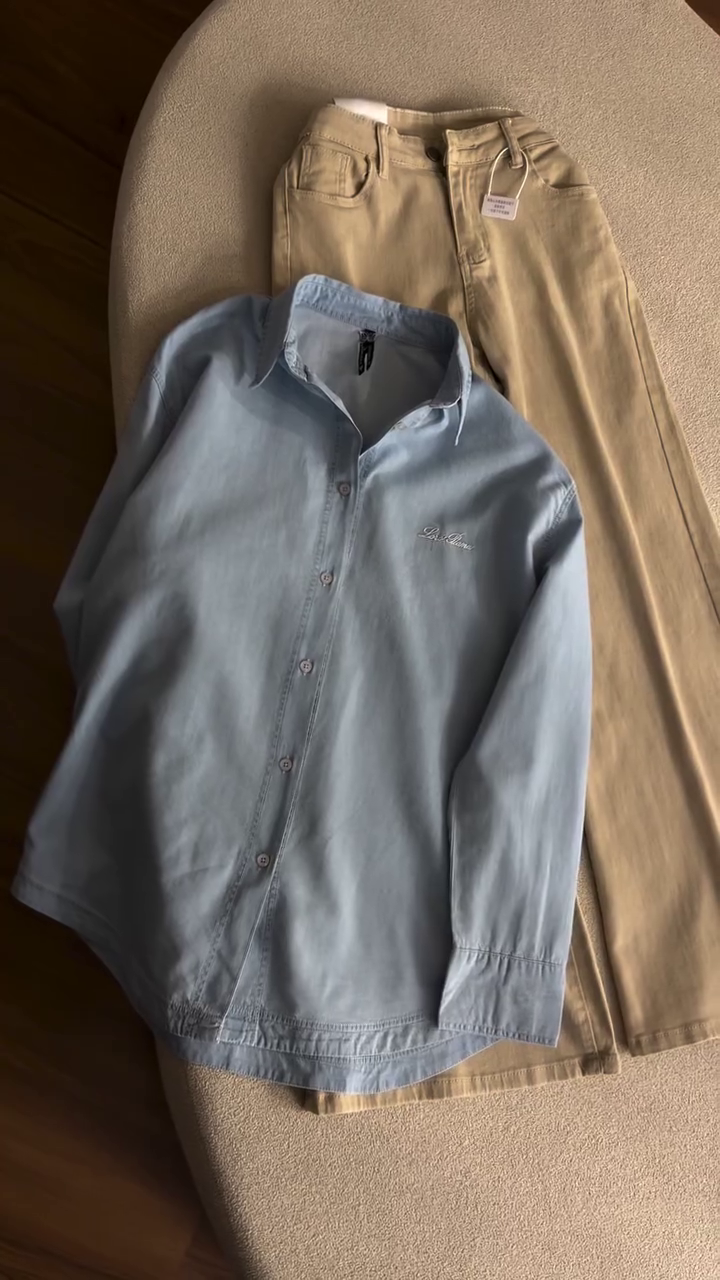 Timeless Casual Elegance: Light Blue Button-Down Shirt with Beige Trousers