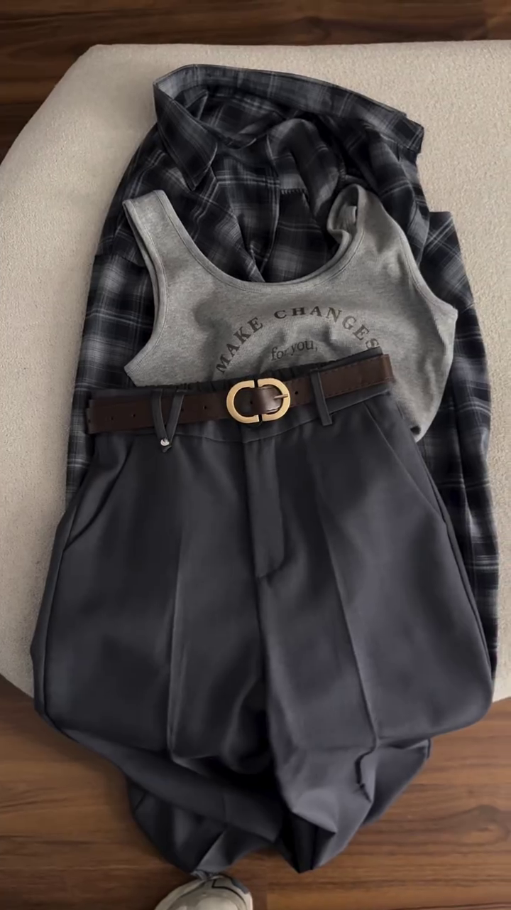 Effortless Layered Style: Grey Graphic Tank, Plaid Shirt & High-Waisted Pleated Trousers