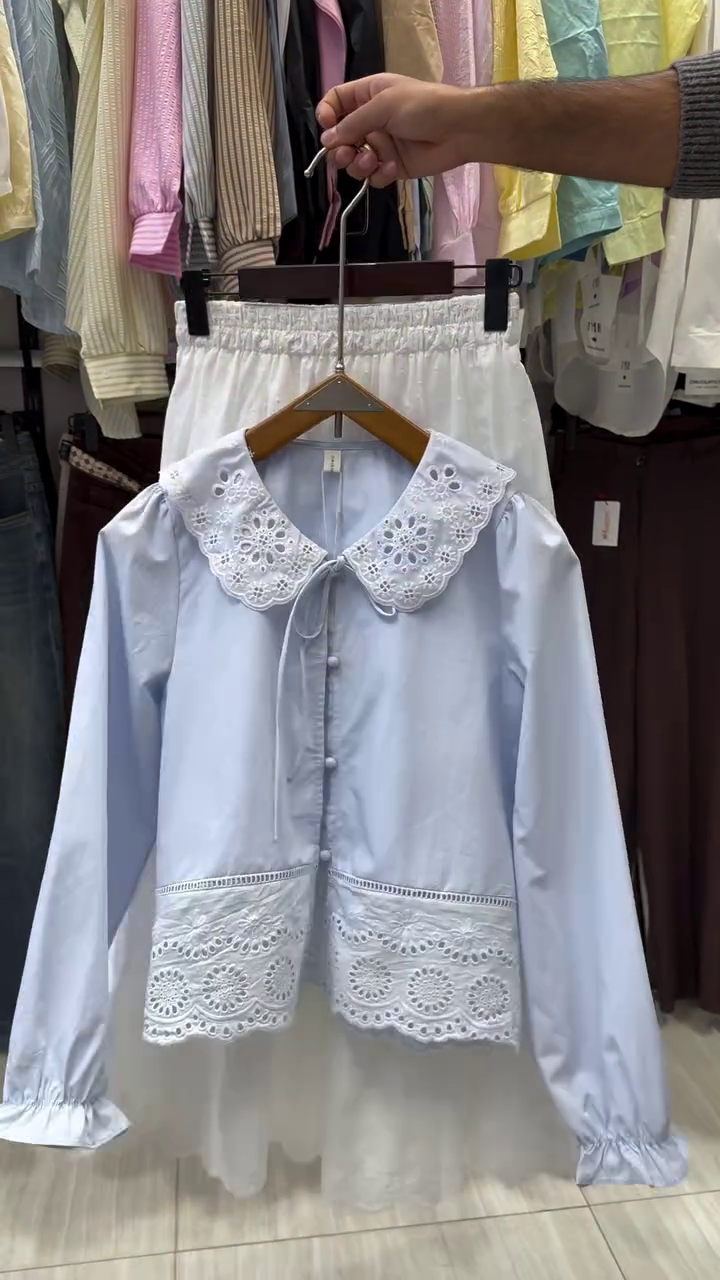 “Classic Elegance: Styling a Long-Sleeve Button-Up Top with a Skirt”