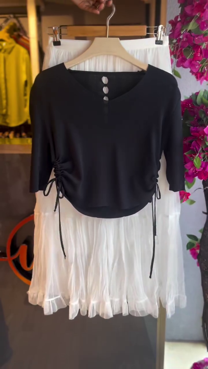 “Monochrome Chic: Black Side-Drawstring Top with White Skirt Two-Piece Set”
