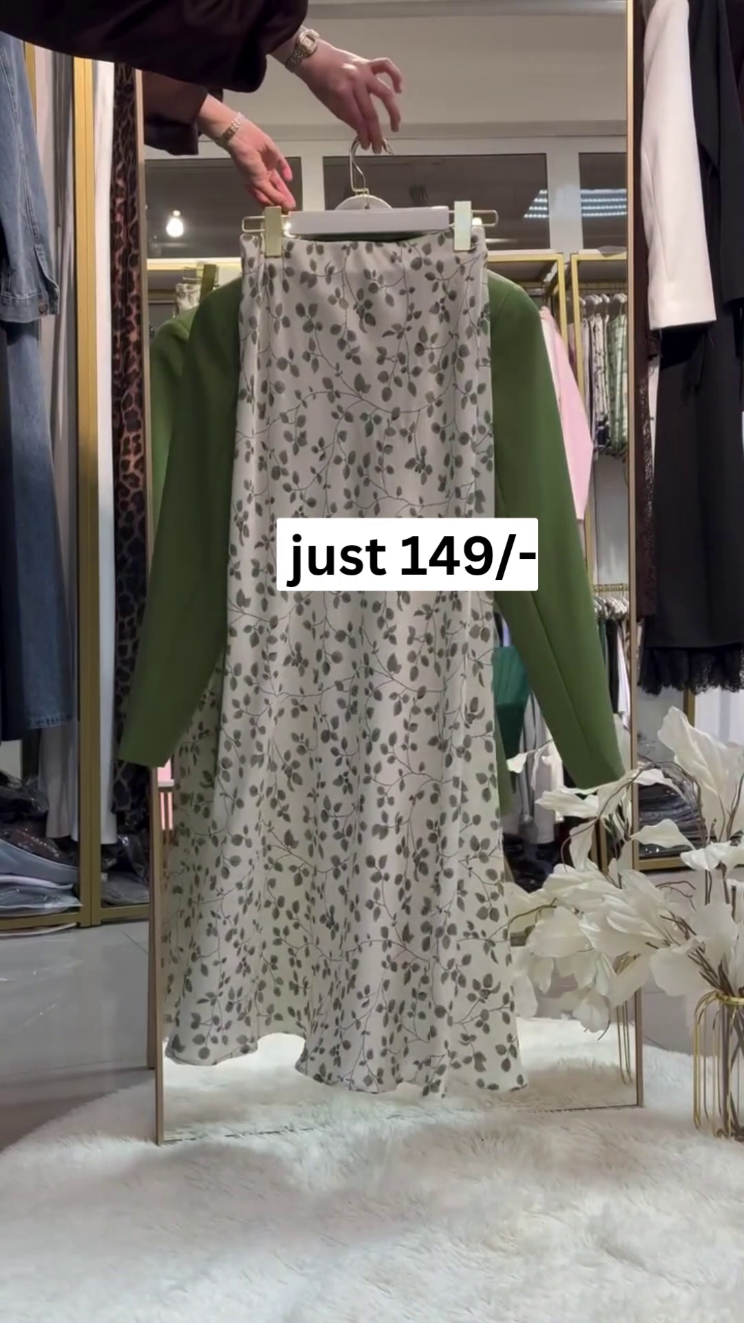 “Chic Coordination: Green Blazer with Patterned Skirt Set”