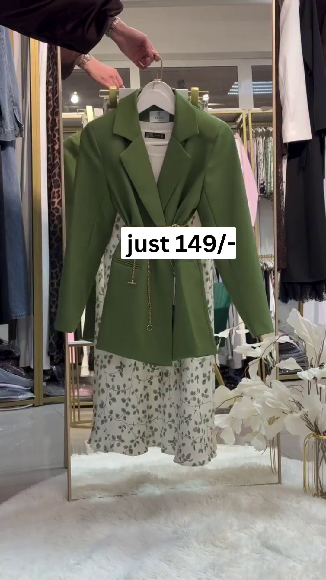 “Chic Coordination: Green Blazer with Patterned Skirt Set”