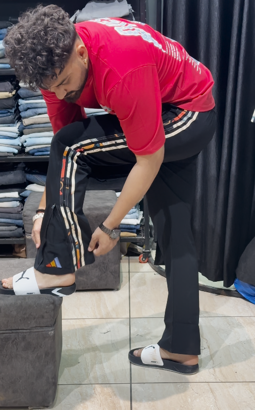 “Casual Cool: Black Track Pants with Side-Stripe Detailing”