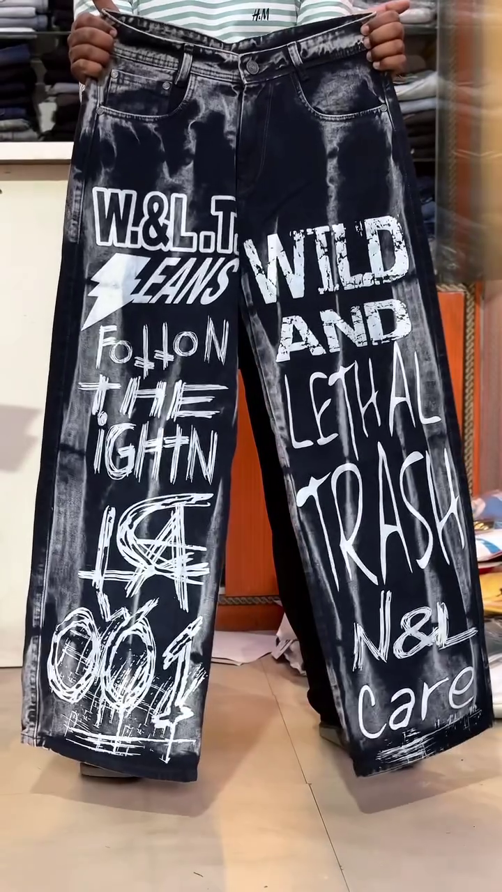 Urban Edge Statement: Black Wash Baggy Denim Jeans with White Graffiti Graphics