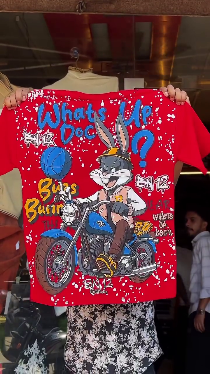 Playful Street Style: White Graphic T-Shirt Featuring Bugs Bunny Motorcycle Design