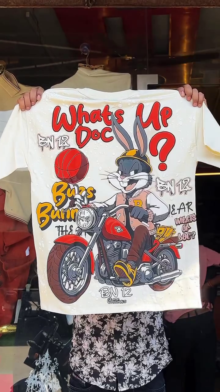 Playful Street Style: White Graphic T-Shirt Featuring Bugs Bunny Motorcycle Design