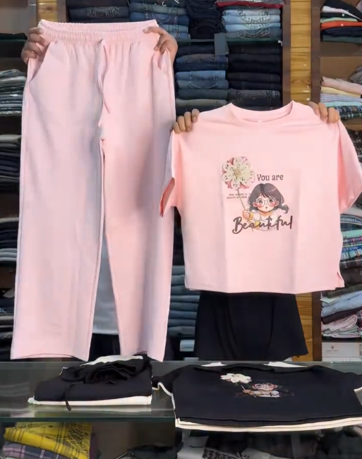 Soft & Stylish Comfort: Pastel Pink Cotton Co-Ord Set for Girls with Graphic T-Shirt & Wide-Leg Trousers