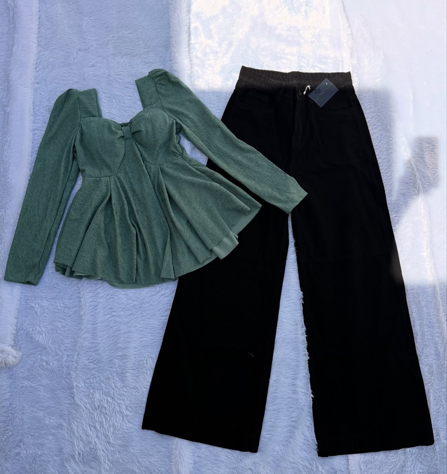 Elegant Contrast Style: Purple Square-Neck Peplum Top Paired with Black Wide-Leg Jeans