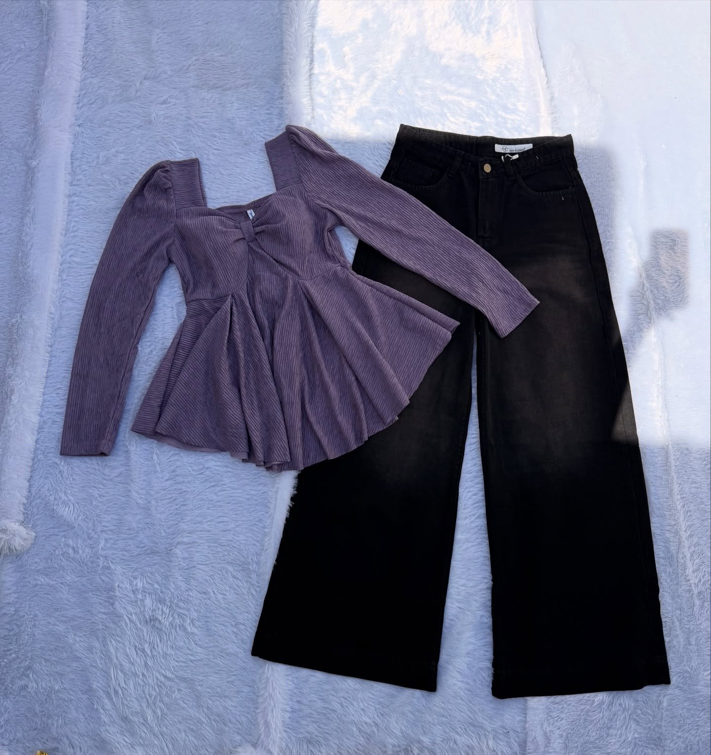 Elegant Contrast Style: Purple Square-Neck Peplum Top Paired with Black Wide-Leg Jeans